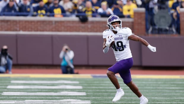 Oct 23, 2021; Ann Arbor, Michigan, USA; Northwestern Wildcats wide receiver Jacob Gill (19) runs the ball against the Michigan Wolverines at Michigan Stadium. Mandatory Credit: Rick Osentoski-USA TODAY Sports